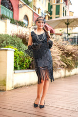 A 1920s Flapper Dress in Black with Scoop neckline, sequins, beads and fringes