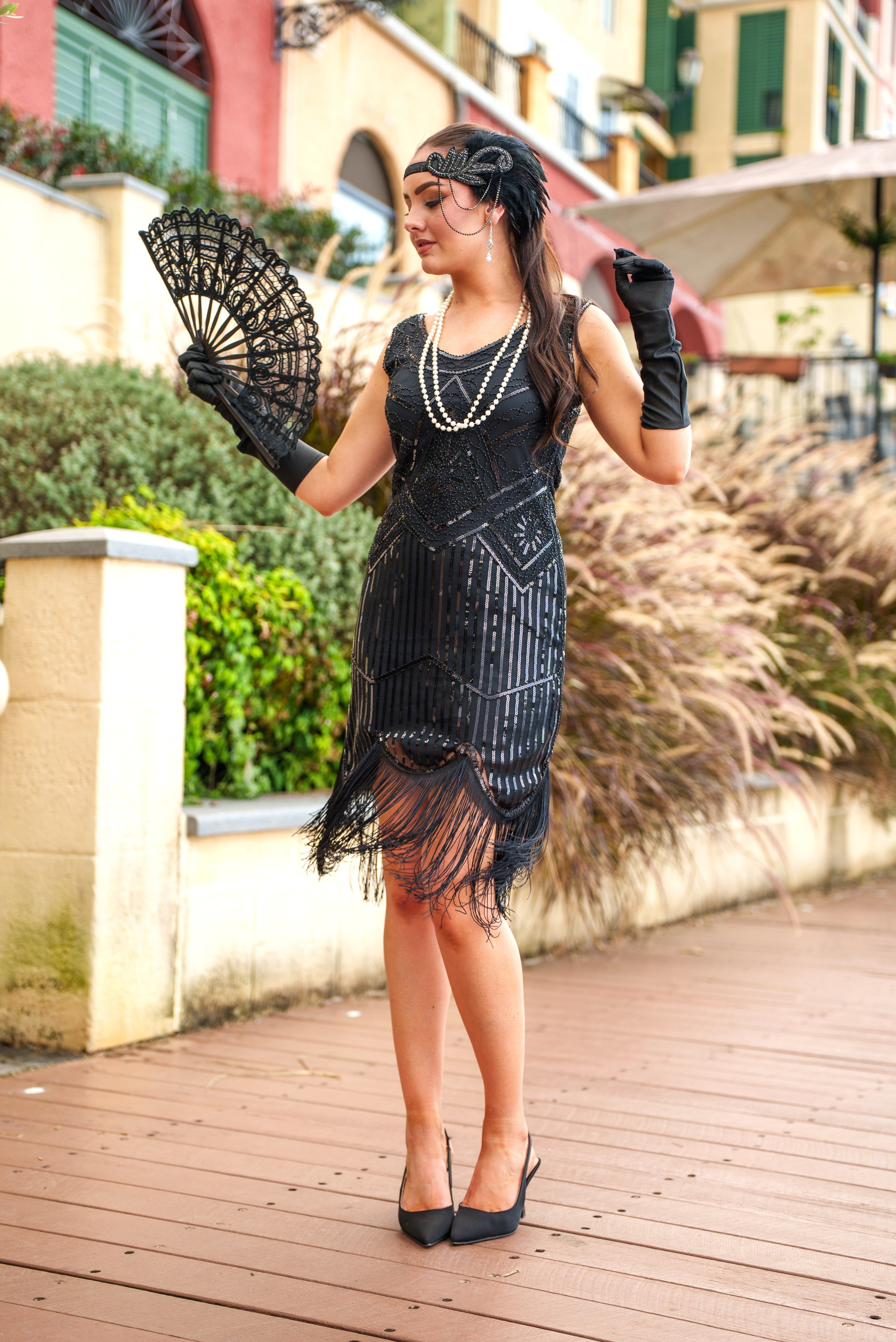 A 1920s Flapper Dress in Black with Scoop neckline, sequins, beads and fringes