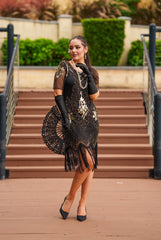1920s Black and Gold Flapper Dress with sleeves – features sequins, beads, and fringe. Perfect for Gatsby parties