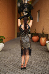 Back View 1920s Black and Gold Stella Flapper Dress with sequins, beads, and fringe – perfect for Gatsby themed parties