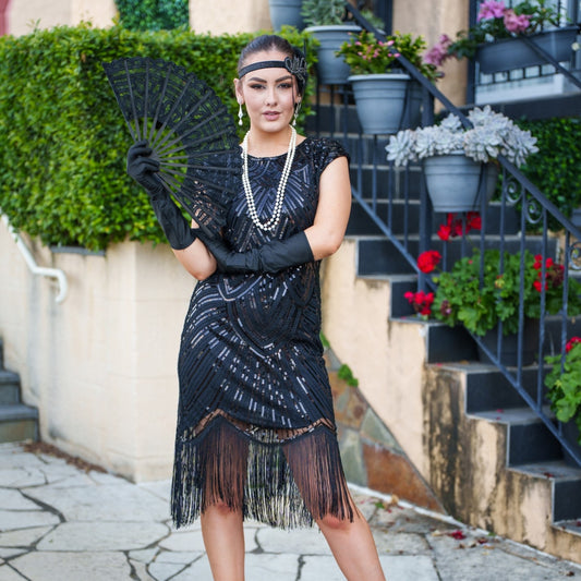 A black Roaring 1920s Flapper Dress