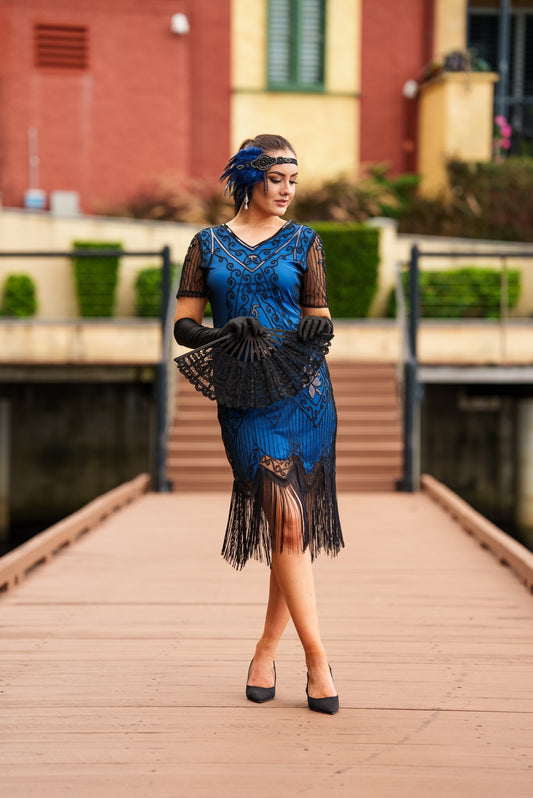 A Stunning Blue 1920s Flapper Dress with Sleeves, Black Sequins, Black Beads and Fringes.