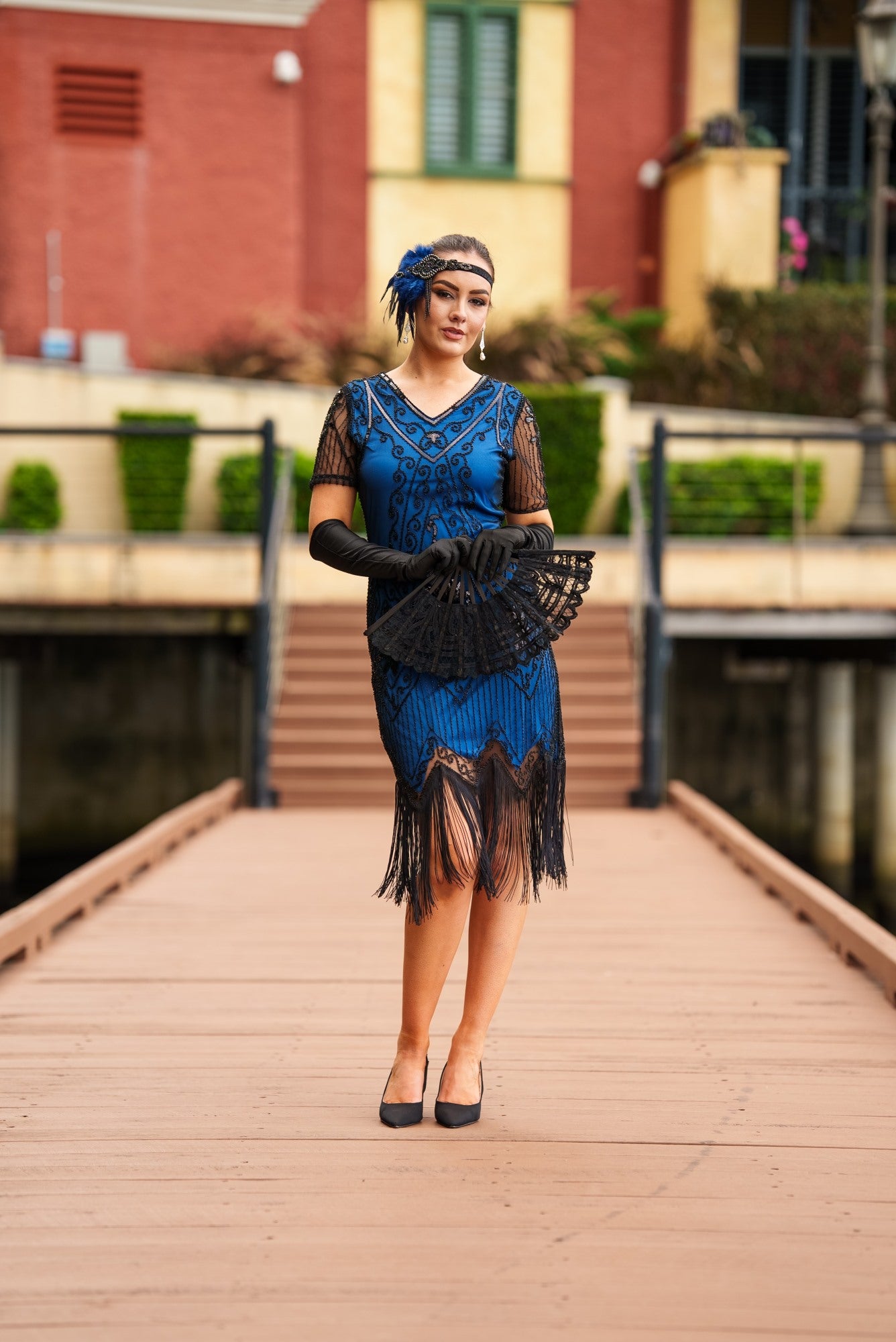 A Stunning Blue 1920s Flapper Dress with Sleeves, Black Sequins, Black Beads and Fringes.