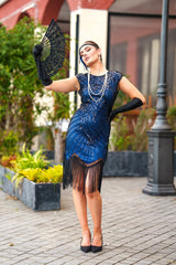 A 1920s Flapper Dress in Navy Blue. Modern Style with Beads, Sequins and Fringes around the Hem.