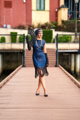 A 1920s Flapper Dress in Navy Blue. Modern Style with Beads, Sequins and Fringes around the Hem.