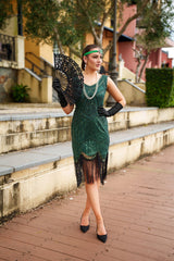 A stunning Green 1920s Flapper Dress with sequins, beads and fringes