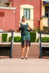 A stunning Green 1920s Flapper Dress with sequins, beads and fringes