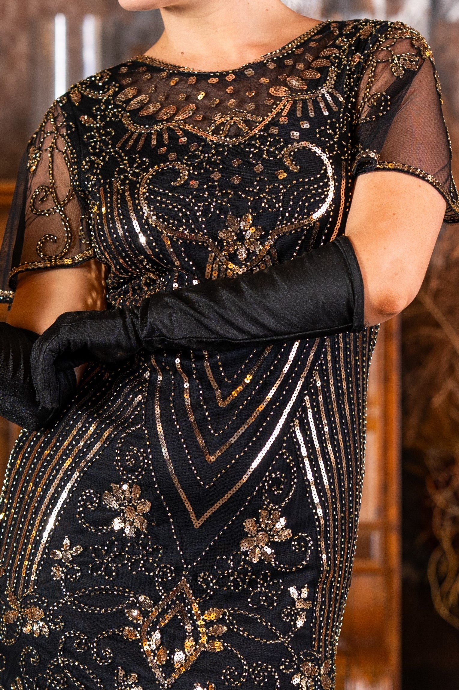 A Black & Gold 1920s Short Flapper Dress with sleeves