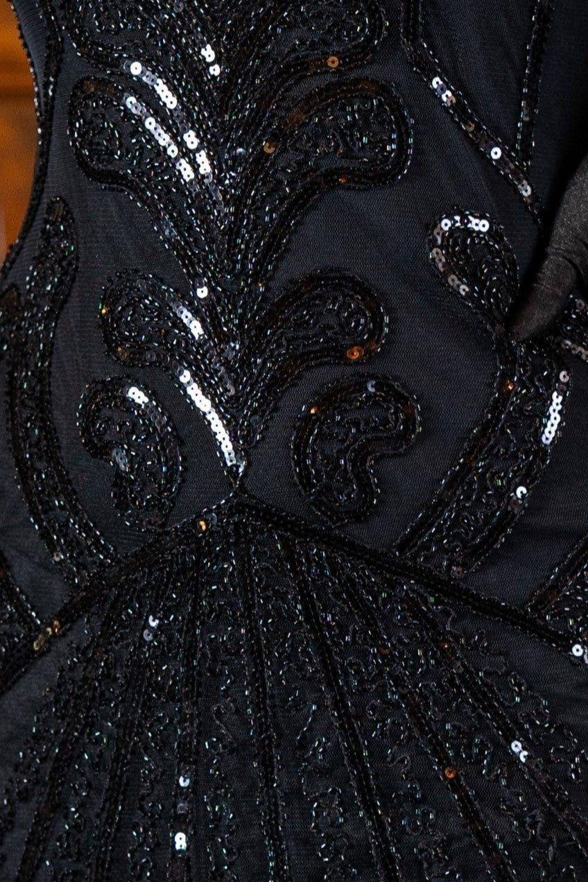 Model wearing a Black 1920s Flapper Dress in Black