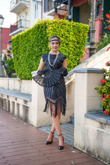 A black Roaring 1920s Flapper Dress