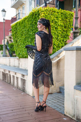 A black Roaring 1920s Flapper Dress