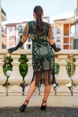 A Green 1920s Gatsby Dress with Sleeves, Green and Gold Sequins, Beads and Fringes around the Hem.