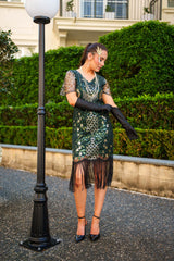 A Green 1920s Gatsby Dress with Sleeves, Green and Gold Sequins, Beads and Fringes around the Hem.