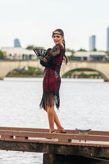 A Stunning Red 1920s Flapper Dress with Sleeves, Black Sequins, Black Beads and Fringes.