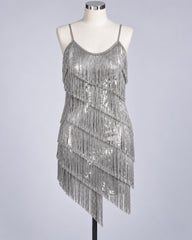 A silver sequined 1920z fringe flapper dress displayed on a white mannequin against a light gray studio background.