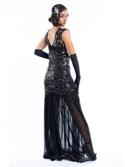 A long black flapper dress with black sequins and silver beads