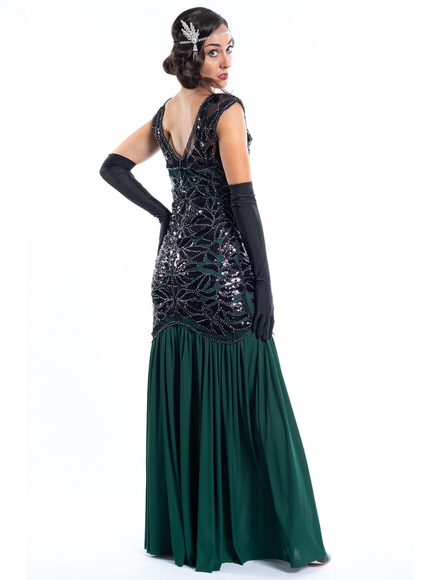 A long green flapper dress with black sequins and beads