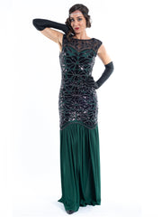 A long green flapper dress with black sequins and beads