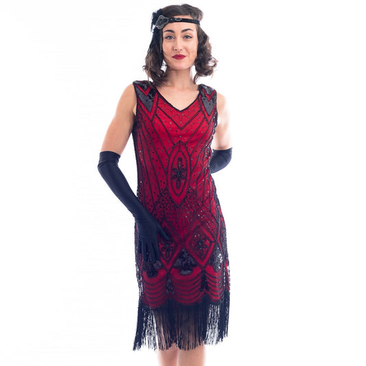 A close view of a Red Gatsby Dress with deco pattern of black sequins and beads.