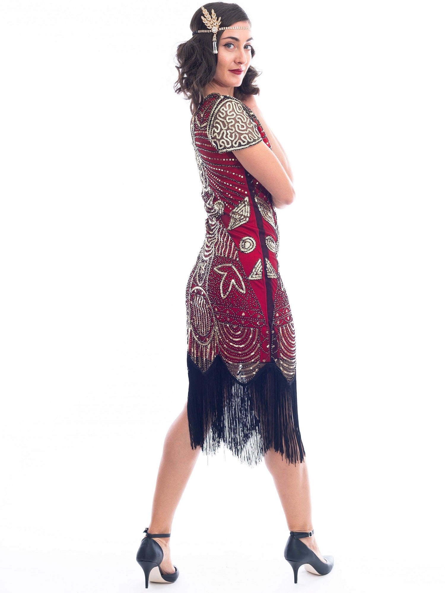 A side view of a Red 1920s Gatsby Dress with gold beads, gold sequins and black fringes around hem