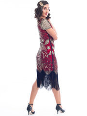 A side view of a Red 1920s Gatsby Dress with gold beads, gold sequins and black fringes around hem