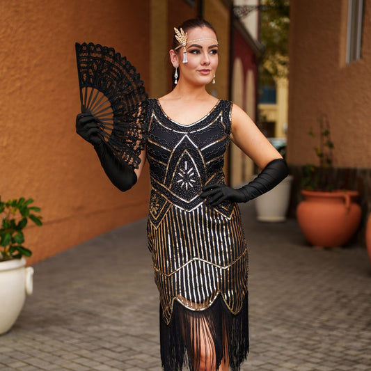 1920s Black and Gold Stella Flapper Dress with sequins, beads, and fringe – perfect for Gatsby themed parties