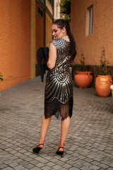 Back View 1920s Black and Gold Flapper Dress with Beads, Sequins and Fringes. Perfect for Roaring 20s Gatsby Parties