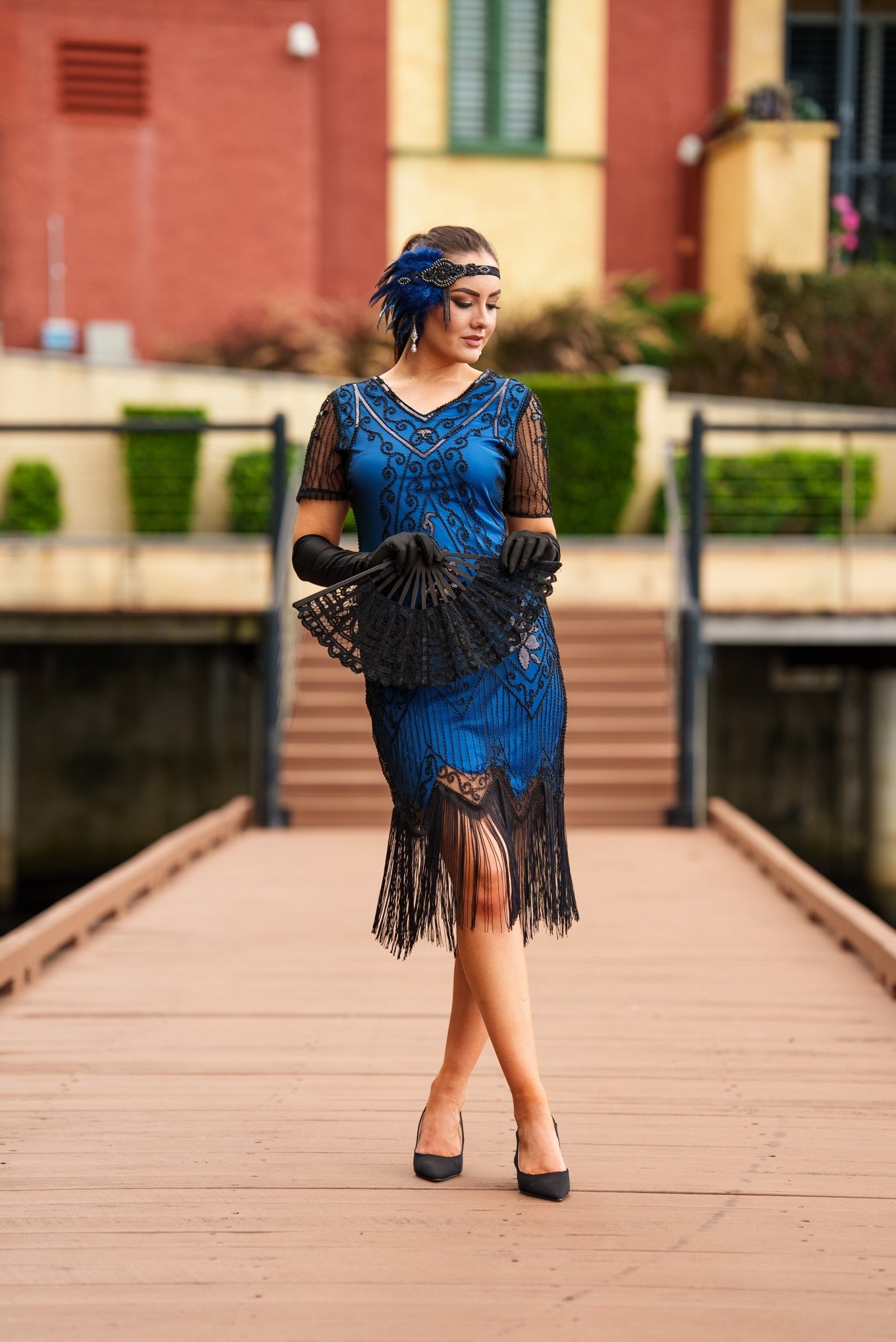 A Stunning Blue 1920s Flapper Dress with Sleeves, Black Sequins, Black Beads and Fringes. 