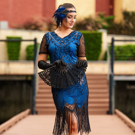 A Stunning Blue 1920s Flapper Dress with Sleeves, Black Sequins, Black Beads and Fringes. 