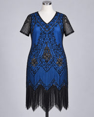 A blue 1920s flapper-style dress with black sequin embroidery, fringe, and sheer black short sleeves, displayed on a mannequin against a light gray background.