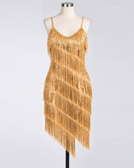 A gold fringe & sequin 1920s flapper dress displayed on a mannequin against a light gray studio background.