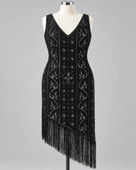 A black sleeveless flapper-style dress with silver beaded vertical panels, floral motifs, and long fringe along the asymmetrical hem, displayed on a mannequin against a light gray background.