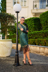 Side View of a 1920s Green Gatsby Dress with sequins, beads, sleeves and fringes. Perfect for Gatsby Parties