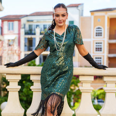 Close View of a 1920s Green Gatsby Dress with sequins, beads, sleeves and fringes. Perfect for Gatsby Parties