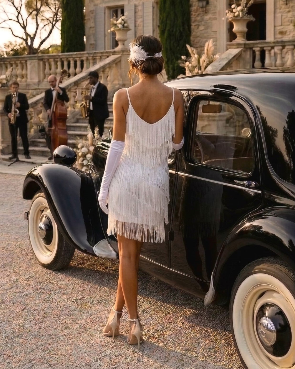 Lady wearing a a 1920s Style Cocktail Dress with white sequins and fringes in vintage estate