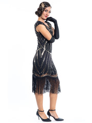 A black flapper dress with gold sequins and beads