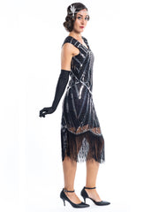 A black flapper dress with silver sequins and beads