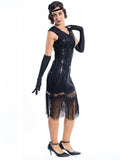 A black flapper dress with a pattern of beads and sequins