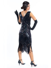 A vintage 1920s black great gatsby dress with sequins and beads