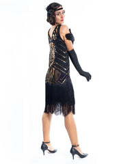 A black flapper dress with gold sequins, beads and black fringes around the hem - Back View
