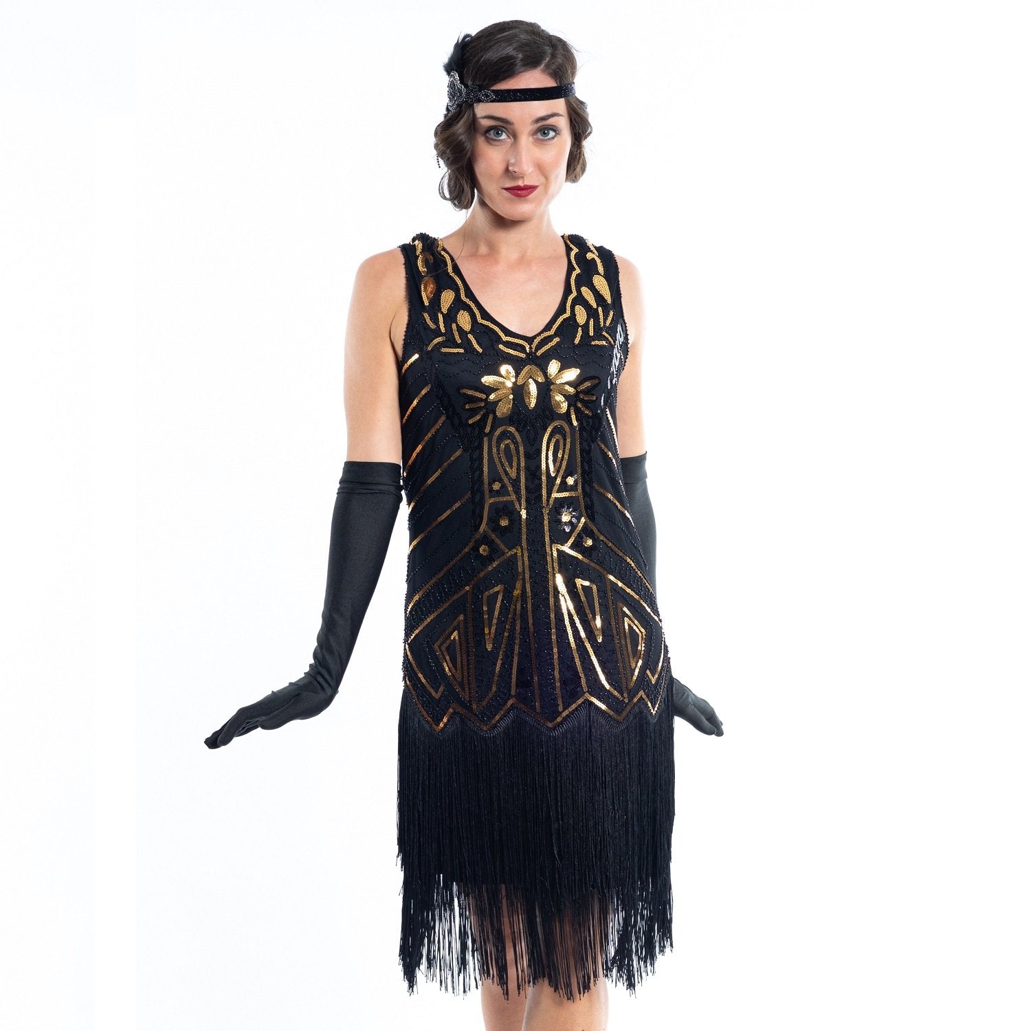 A black flapper dress with gold sequins, beads and black fringes around the hem - Close View