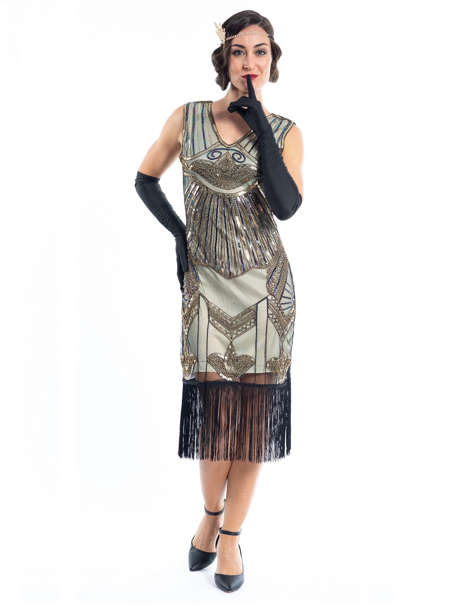 A gold flapper dress with a 1920s deco pattern of sequins, beads and fringes around the hem