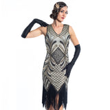 A vintage flapper dress with gold sequins, gold beads and fringes around the hem - Close View