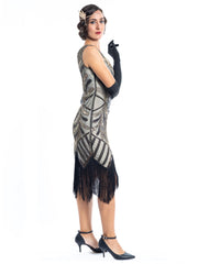 A vintage flapper dress with gold sequins, gold beads and fringes around the hem - Side View