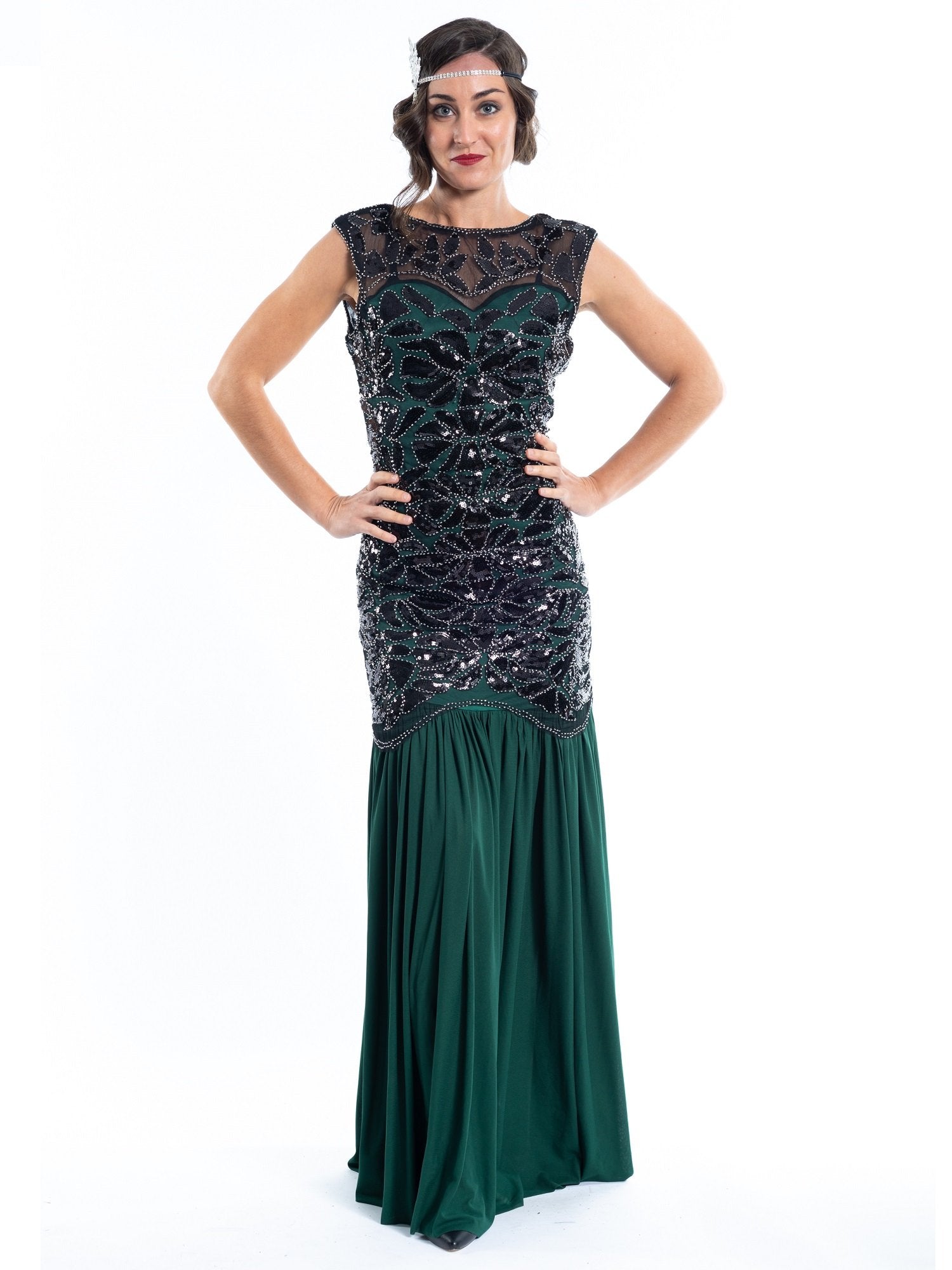 A long green flapper dress with black sequins and beads
