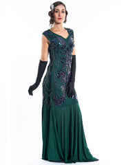 A long green gatsby dress with black sequins and beads