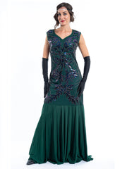 A long green gatsby dress with black sequins and beads