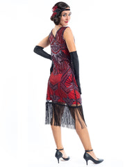 A red flapper dress with a 1920s deco pattern of sequins, beads and fringes around the hem - Back View