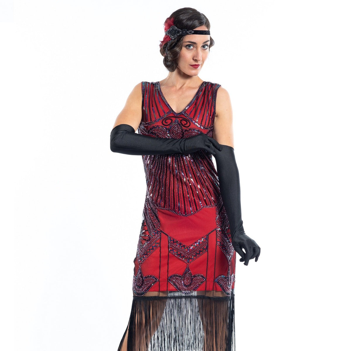 A red flapper dress with a 1920s deco pattern of sequins, beads and fringes around the hem - Close View