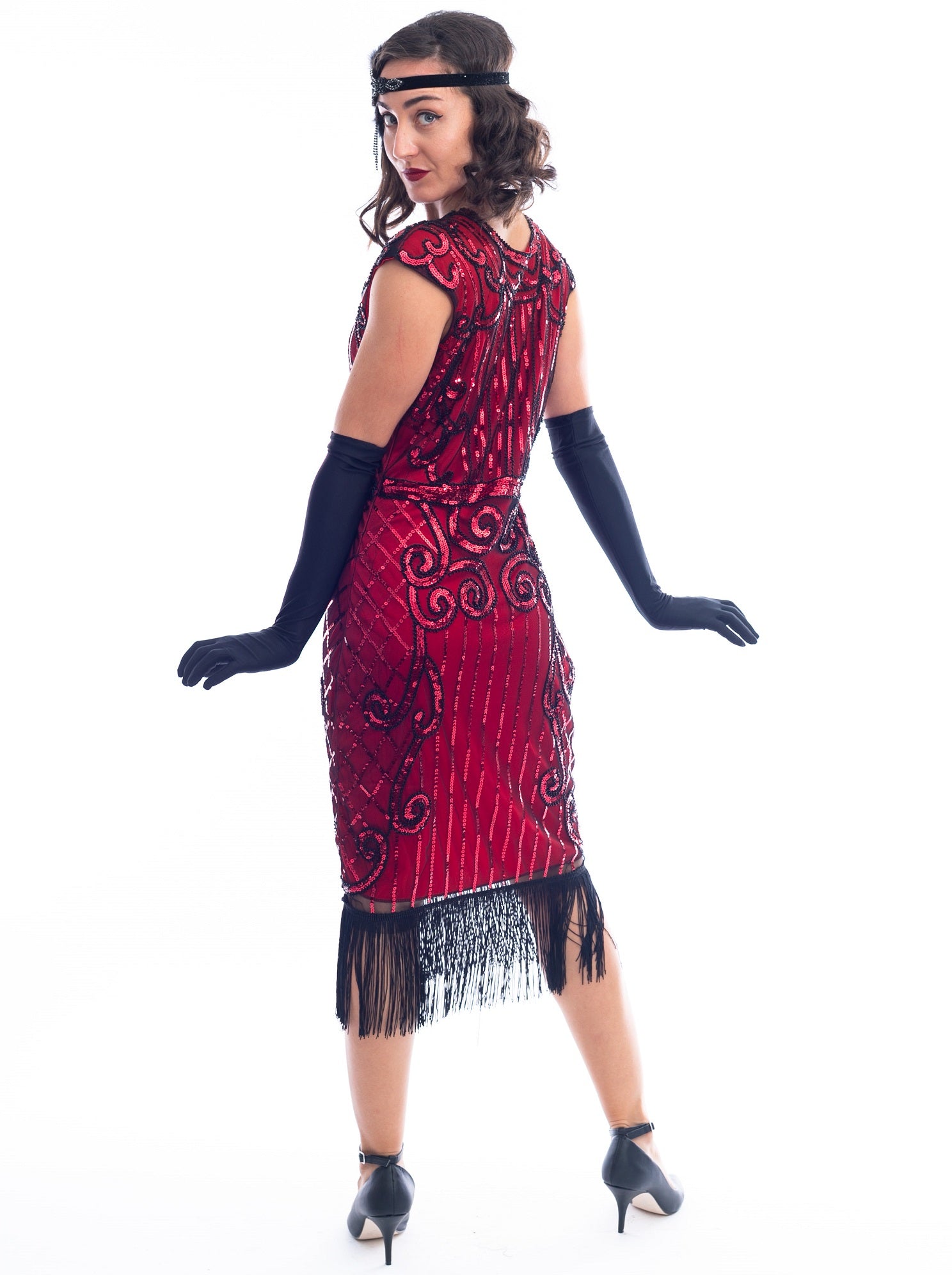 A back view of a Red Flapper Dress with a cocktail and deco pattern of red sequins and black beads.